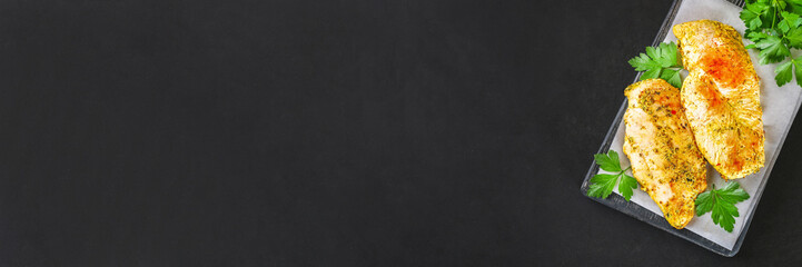 healthy food - grilled chicken with vegetables on a wooden board.