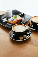 Cup Of Coffee Drink And Dessert On Plate In Cafe