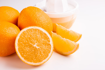 oranges and juice on a white background