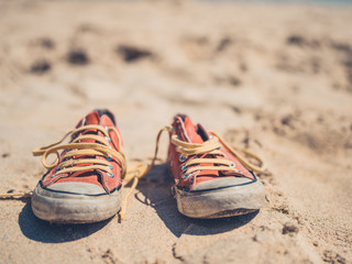 Obraz premium Sneakers on the beach