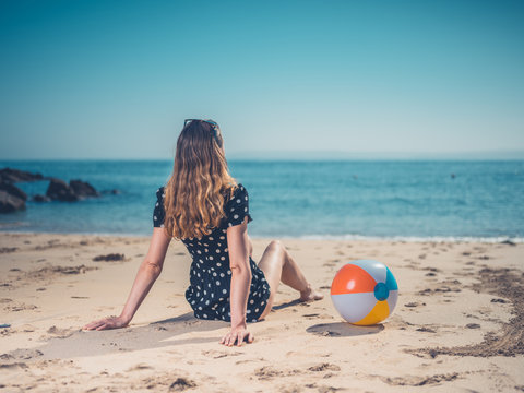 Young woman with beach ball