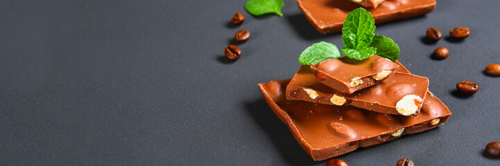 chocolate with almonds on dark grey background.