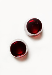 Fresh pomegranate juice in glass on white background, top view