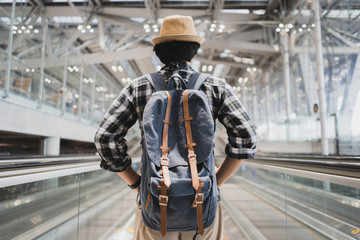 back view Asian man tourist in airport.