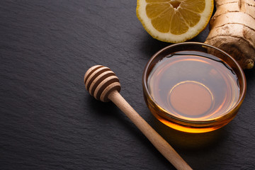 Ginger root on a dark stone background