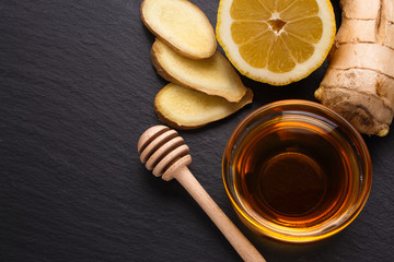 Ginger root on a dark stone background