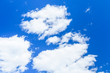 White fluffy clouds in a deep blue sky