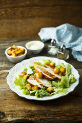 Grilled chicken Caesar salad with avocado