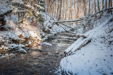 Winter waterfall cascades. Glazskunis Long waterfall. Latvia. Baltic.