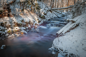 Long exposure waterfall. Winter waterfall cascades.  Glazskunis Long waterfall. Latvia. Baltic.