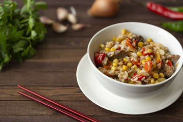 Delicious homemade wok fried rice with meat and vegetables