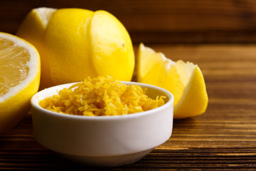 Lemon and juice on a wooden background