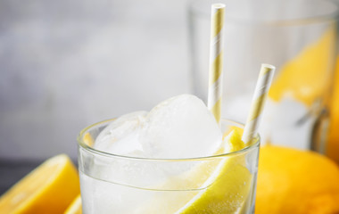 Summer cocktail with soda, gray background, selective focus