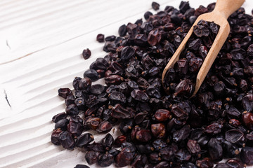 dried barberry berries on the rustic background