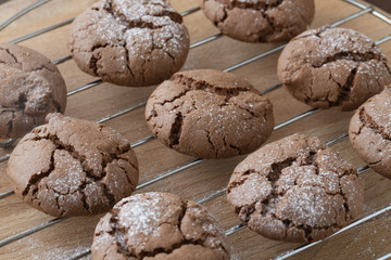 Chocolate chip cookies cooling on a rack. 