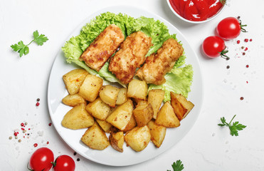 Fish and chips with tomato sauce ketchup, white background, top view
