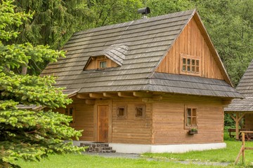 Obraz premium Europe, country Slovakia, locality Liptov, village Liptovsky Jan. Wooden holiday cottage, built in beautiful countryside in mountain forests.