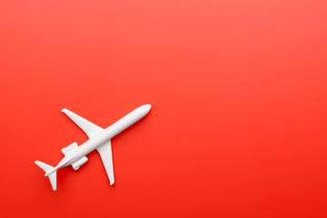 Toy plane on red background