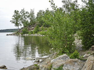 Summer landscape: calm river and green beaches