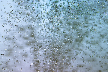 splashing water blue background. Frozen drops instant