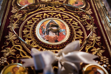 Wedding crowns and rings on the holly bible, prepared for ceremony