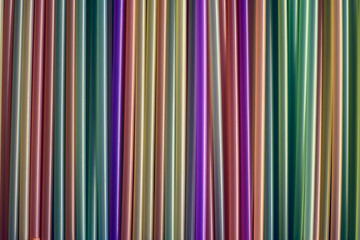 Many different colored plastic drinking straws