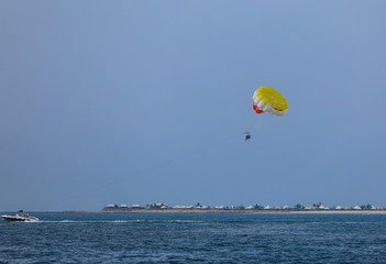skydiver flies over the sea