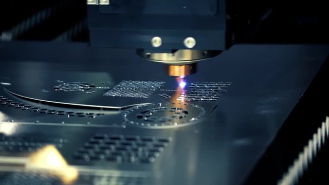 CNC Laser cutting of metal, modern industrial technology.