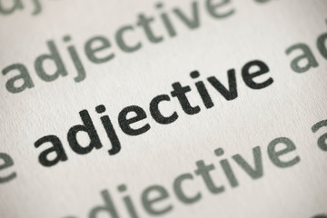 word adjective printed on paper macro