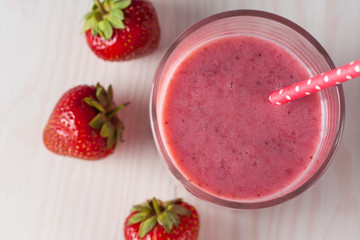 Glasses of milkshakes with chocolate, strawberry, banana flavor, with ice cream on wooden blue and white background. Sweet drinks for summer concept. Shakes and smoothies. Milk shake and cocktail.