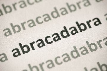 Fototapeta premium word abracadabra printed on paper macro