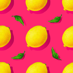 Yellow lemon fruits with green leaves isolated on pink background. Watercolor drawing seamless pattern for design