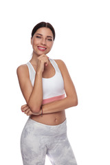 portrait of beautiful pensive fitness woman standing