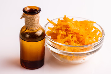 orange essential oil on a white background