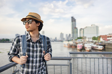 Asian man bag pack tourist in travelling at Thailand.