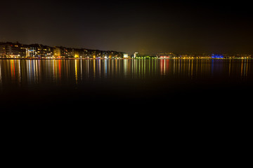 Thessaloniki, Greece, colorful long exposure photo of the city view of the harbor at night from the dock