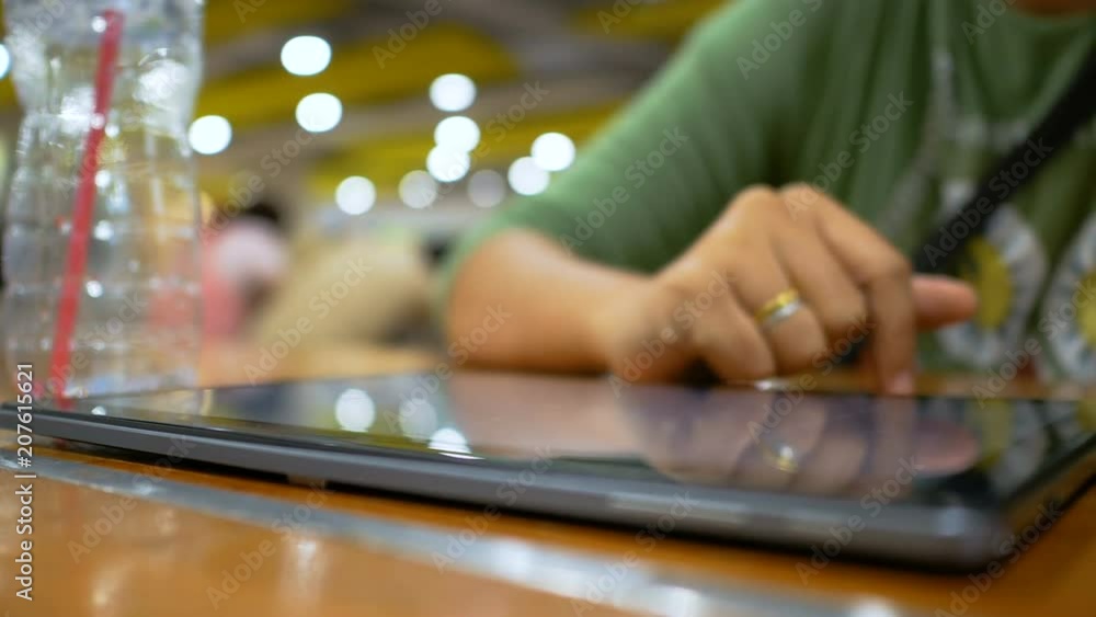 Poster hand of woman using tablet for application and wireless device concept select focus shallow depth of