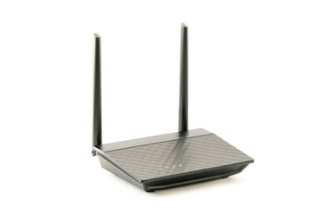 Fototapeta premium Black Wireless internet network wi-fi Router with two antenna isolated on white background. With clipping path. Design element.
