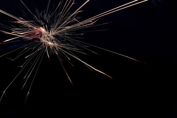 amazing Sparks caused by anode and negative touch. on a black background. 1
