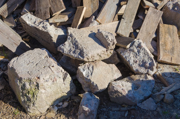 dump of stones and boards