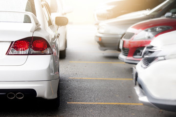 Naklejka premium White car parking on the road prepare for race or parking, on body with drop of rain.