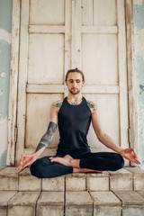 Male yoga, meditation in asana position