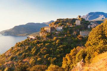 Naklejka premium Village of Nonza, Corsica, France at sunset