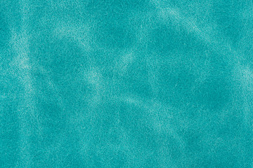Texture background from turquoise leather of small grain