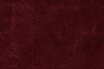 Texture background from burgundy leather suede. seamless