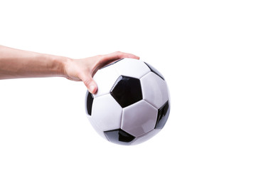 Hand holding soccer ball isolated on white background.
