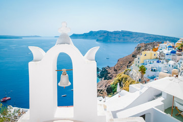 Greek whitewashed church dome with blue roof at Oia Santorini Greece
