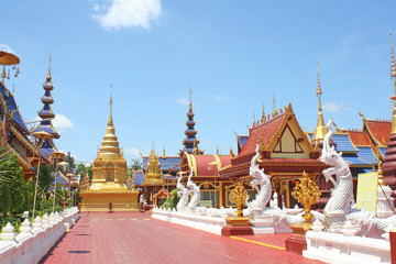 Fototapeta premium Landscape at Phiphat Mongkol Wanaram temple on vivid blue sky in Sukhothai, Thailand