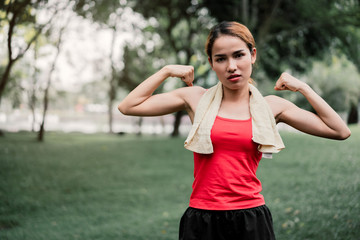 portrait strength woman bicep muscle.