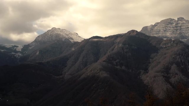 Timelapse - Clouds Float Above The High Beautiful Mountains And Hills Covered With Forest In The Cold Autumn Time